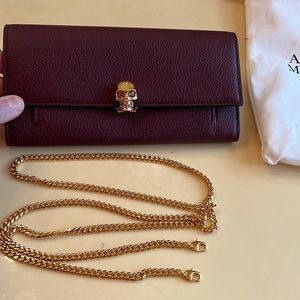 Iconic embellished skull gold turn lock with crystals. Zip purse, 6 cc slots.